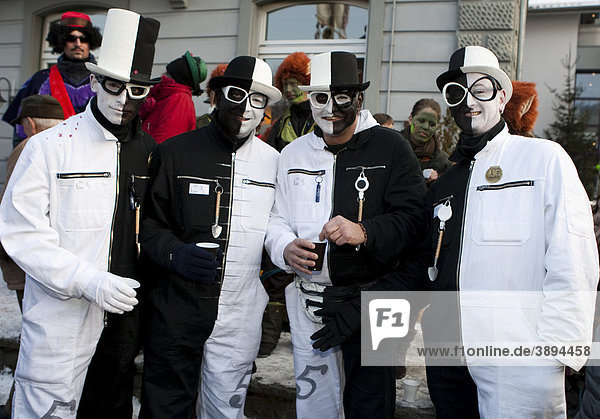 Black and white men with top hats at the carnival procession in Malters  Lucerne  Switzerland  Europe