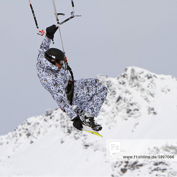 Snow kiting  snow boarder with kite  Obertauern  Hohe Tauern region  Salzburg  Austria  Europe