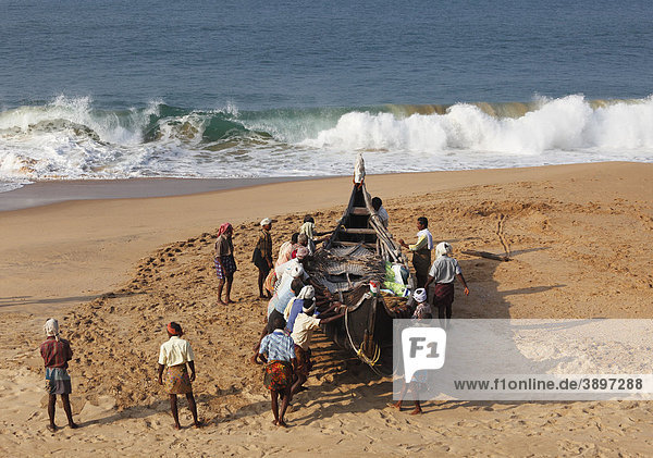 Fishermen pulling their boat on a beach south of Kovalam  Malabar Coast  Malabar  Kerala  southern India  India  Asia