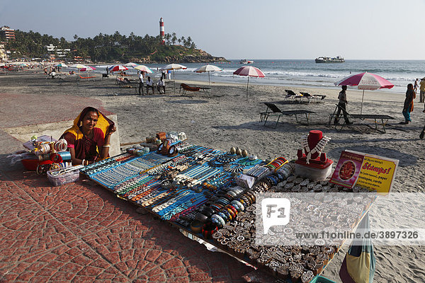 Woman at stall with handcrafted souvenirs  Lighthouse Beach  Kovalam  Malabarian Coast  Malabar  Kerala state  India  Asia