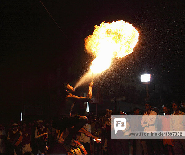 Fire eater  fire-breather  temple festival in Pulinkudi  Kerala state  India  Asia