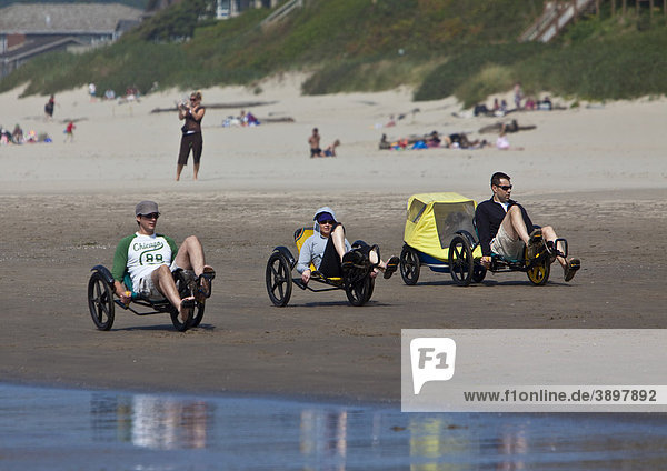 Tourists with three-wheelers at Cannon Beach  Clatsop County  Oregon  USA