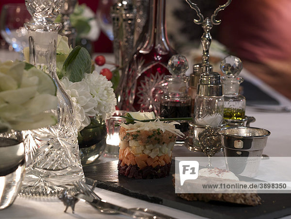 Stylish set table in an upscale ambience with culinary speciality