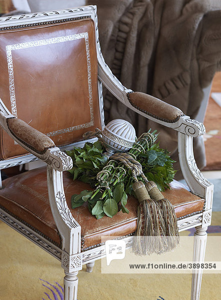 Decorated  antique  leather-covered chair