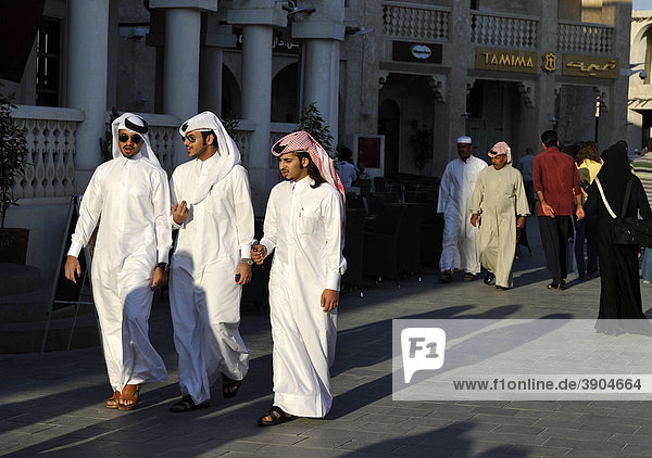 Qatari with ghutrah headdress strolling in the Souq al Waqif  oldest souq or bazaar of Doha  Qatar  Persian Gulf  Middle East  Asia