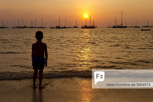 Boy  6 years old  admiring the sunset on Nai Han Beach  Phuket Island  Southern Thailand  Thailand  Southeast Asia