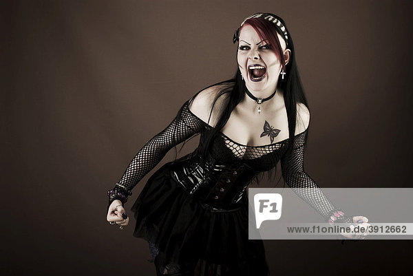 Woman  Gothic style  screaming with clenched fists