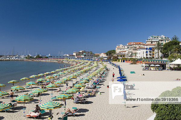 Parasols and deck chairs on the beach San Remo Riviera Liguria Italy Europe