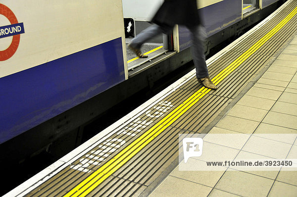 Passenger leaving the underground in the Monument Station  Mind the Gap  London  England  United Kingdom  Europe