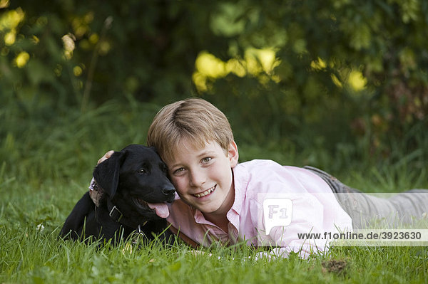 Boy  10  with a labrador puppy