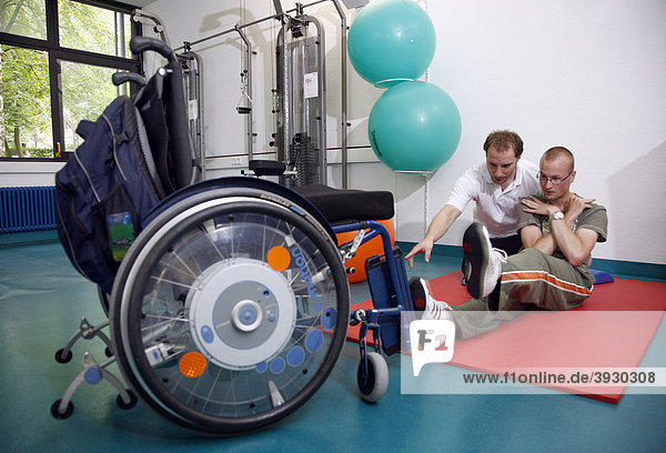 Mobilisation exercises for encouraging movement  muscle training and coordination exercises for a patient  physiotherapy  physical therapy in a neurological rehabilitation centre  Bonn  North Rhine-Westphalia  Germany  Europe