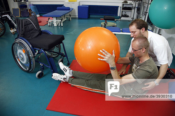 Mobilisation exercises for encouraging movement  muscle training and coordination exercises for a patient  physiotherapy  physical therapy in a neurological rehabilitation centre  Bonn  North Rhine-Westphalia  Germany  Europe