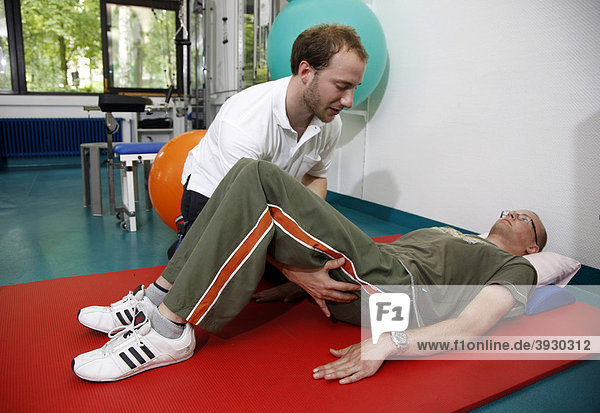 Physiotherapy exercises  mobilisation exercises for encouraging movement  physiotherapy in a neurological rehabilitation centre  Bonn  North Rhine-Westphalia  Germany  Europe