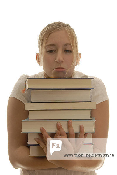 Achtzehnjährige Frau mit Büchern  verzweifelt schauend  Lernstress