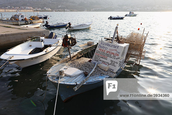Fishing boat with advertising for a fish restaurant  Pag  Pag island  Dalmatia  Adriatic Sea  Croatia  Europe