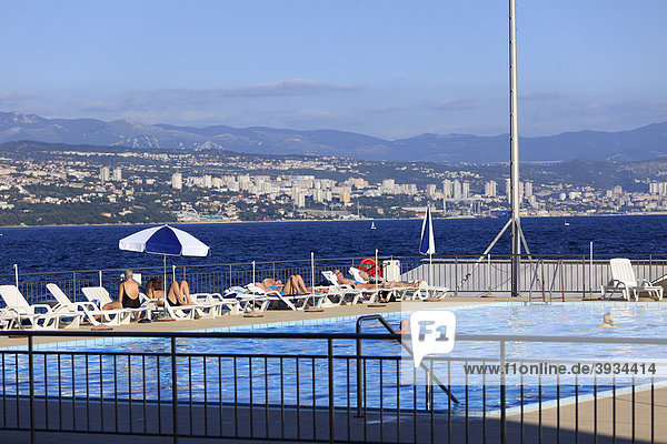 Swimming pool in Opatija in front of the city Rijeka with the Gorski Kotar Mountains in the distance  Istria  Croatia  Europe