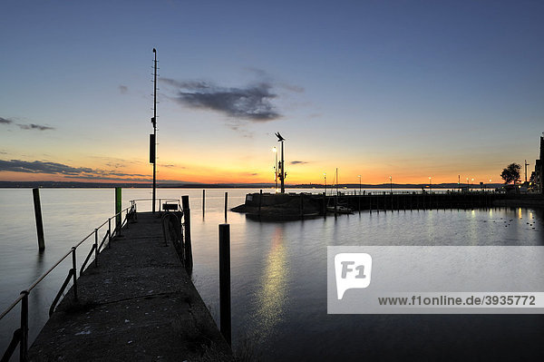 View from the pier over the harbour and the guidance statue after sunset  Lake Constance district  Baden-Wuerttemberg  Germany  Europe