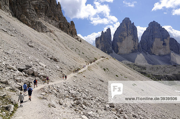 Hikers in front of Three Peaks  Alta Pusteria  Sexten Dolomites  South Tyrol  Italy  Europe