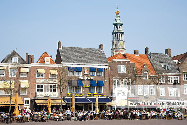Houses at the market square in front of the abbey tower Lange Jan in Middelburg  Walcheren  Zeeland  Netherlands  Europe