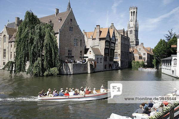Boat tour through canals  historic center of Bruges  Flanders  Belgium  Europe