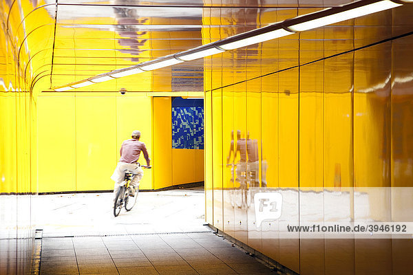 Cyclist riding through an underpass in London  England  United Kingdom  Europe