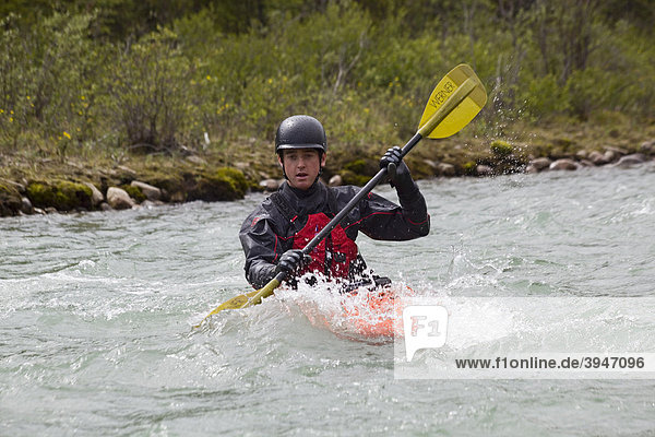 White water kayaking  man paddling a play boat  Wheaton River  Yukon Territory  Canada