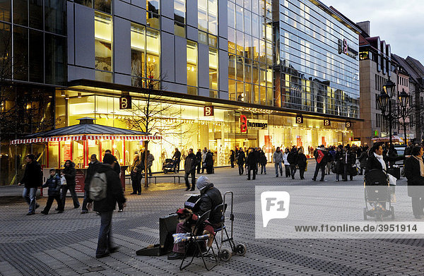 Beggar in front of a store  pedestrian area  Nuremberg  Bavaria  Germany  Europe