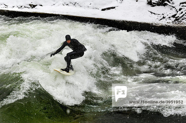 Surfer in Eisbach stream in winter  Munich  Bavaria  Germany  Europe