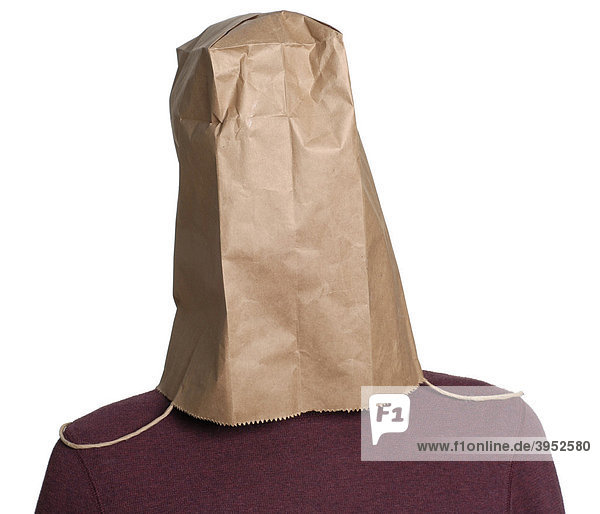 Man hiding his head under a paper shopping bag