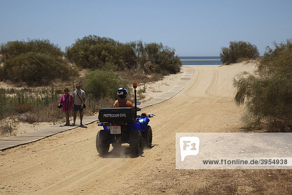 Private security on a quad bike in Isla Canela Costa de la Luz Andalusia Spain Europe