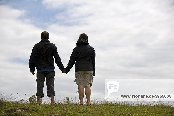 Man  woman  couple holding hands  walking  Great Britain  Europe