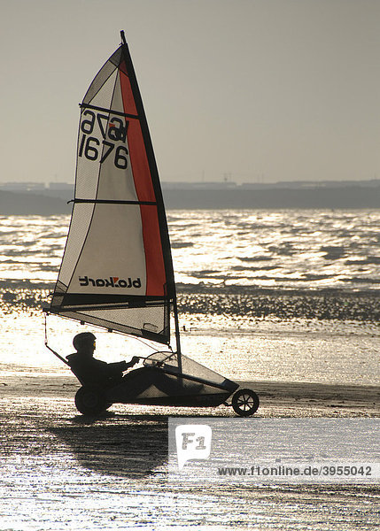 Person in sail wagon on the beach  silhouette  land sailing  sand yachting  Weston super Mare  Somerset  England  Great Britain  Europe