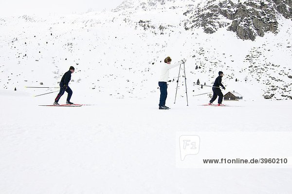 Three cross-country skiers  Andermatt  Switzerland