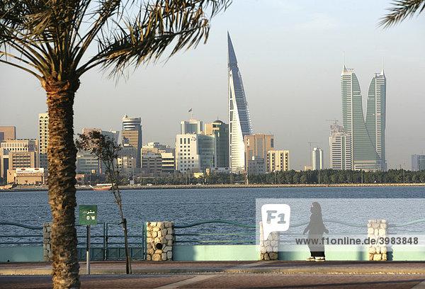 Skyline of the Corniche as seen from King Faisal Highway  Muharraq side  World Trade Center buildings  left  beside the towers of the Financial Harbour Complex  capital city  Manama  Kingdom of Bahrain  Persian Gulf