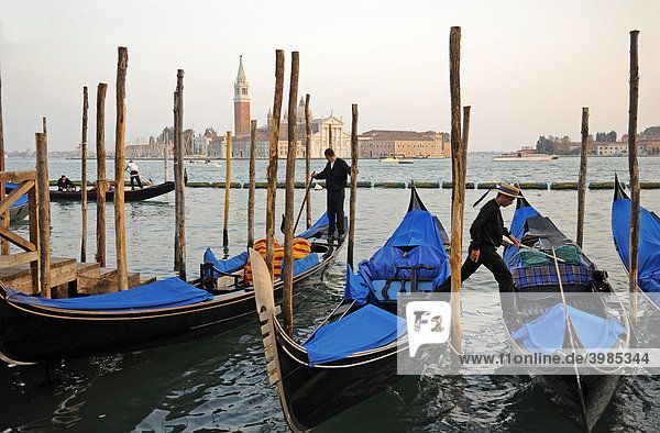 Gondolas on Riva degli Schiavoni  overlooking San Giorgio Maggiore  Venice  Italy  Europe