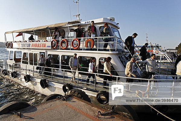 Bosphorus ferry on the pier  people exiting  Ueskuedar  Istanbul  Turkey