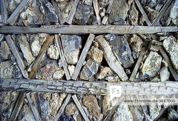 Traditional masonry with wood and broken stones  unplastered  framework  detail  Santorini  Thira  Cyclades  Greece  Europe