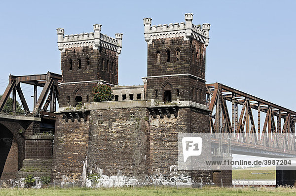 Towers of the former Duisburg-Hochfeld railway bridge over the Rhine River Ruhr area North Rhine-Westphalia Germany Europe