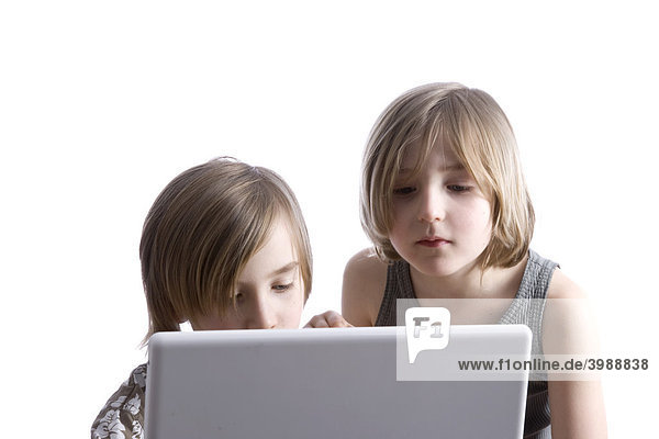 Two boys using a laptop