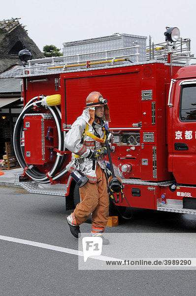 Japanese fire brigade at a serious mission in Arashiyama  Japan  Asia