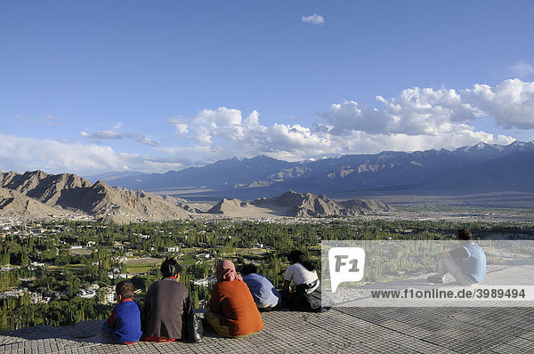 Overlooking the oasis Leh into the Indus Valley  in the foreground Ladakhi people  Ladakh  Northern India  the Himalayas
