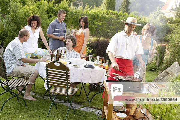 People having a barbecue in the garden