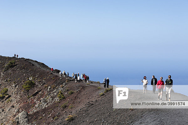Tourists on the crater rim of the volcano Fuencaliente at San Antonio  La Palma  Canary Islands  Spain  Europe