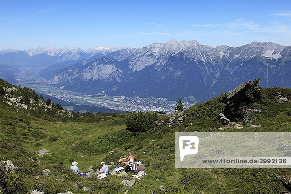 Hikers resting at Mt. Patscherkofel  overlooking the Inntal valley  Tyrol  Austria  Europe