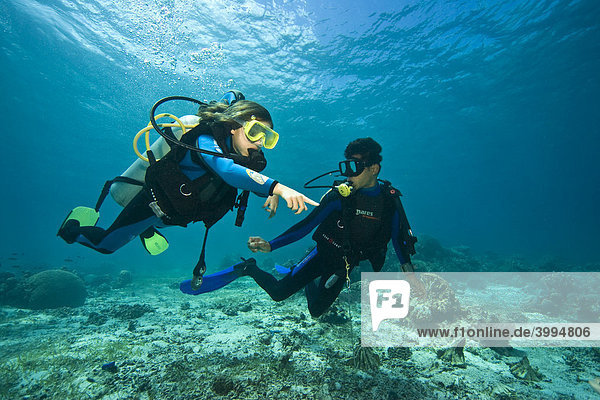 Girl and diving instructor  Philippines  Southeast Asia