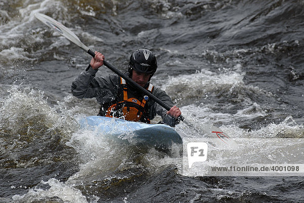 Kayakers in a whitewater races  Glen Etive River Race  Glen Etive  Scotland  UK  Europe