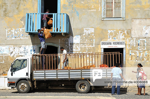 Men unloading a lorry  Sal Rei  Boa Vista Island  Republic of Cape Verde  Africa