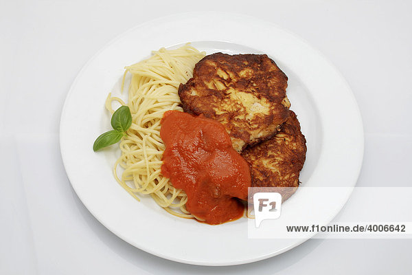 2 Milanese turkey steaks on spaghetti with tomato sugo  basil
