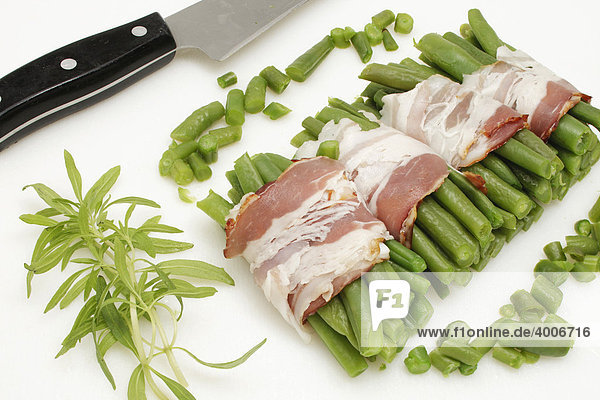 Cooked green beans  bacon-wrapped  cut straight by a knife  fresh savory