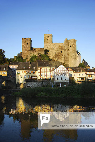 Medieval castle in Runkel an der Lahn is reflected in the Lahn River at sunrise  Runkel  Hesse  Germany  Europe